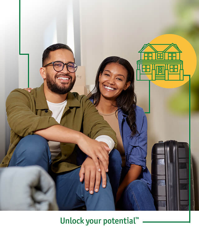 A couple sitting in a room with their luggage ready to apply for a new home loan.